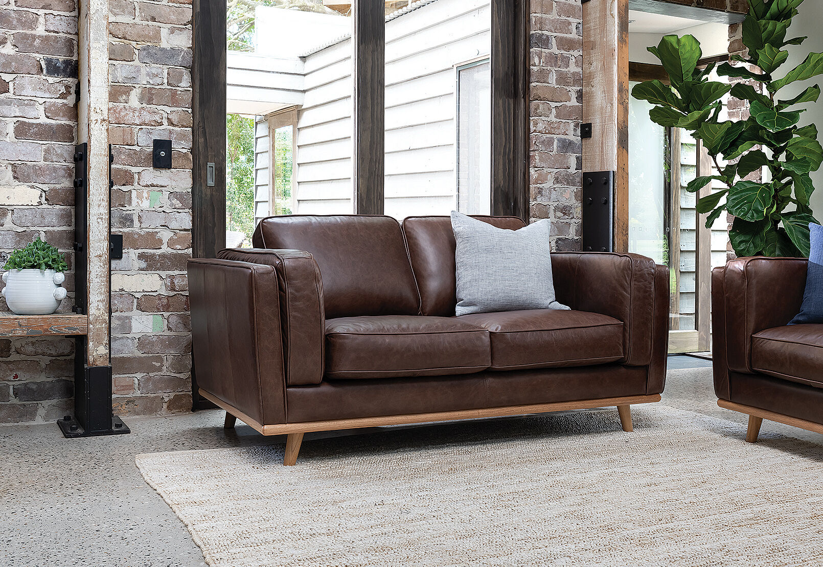 Amart brown leather couch top