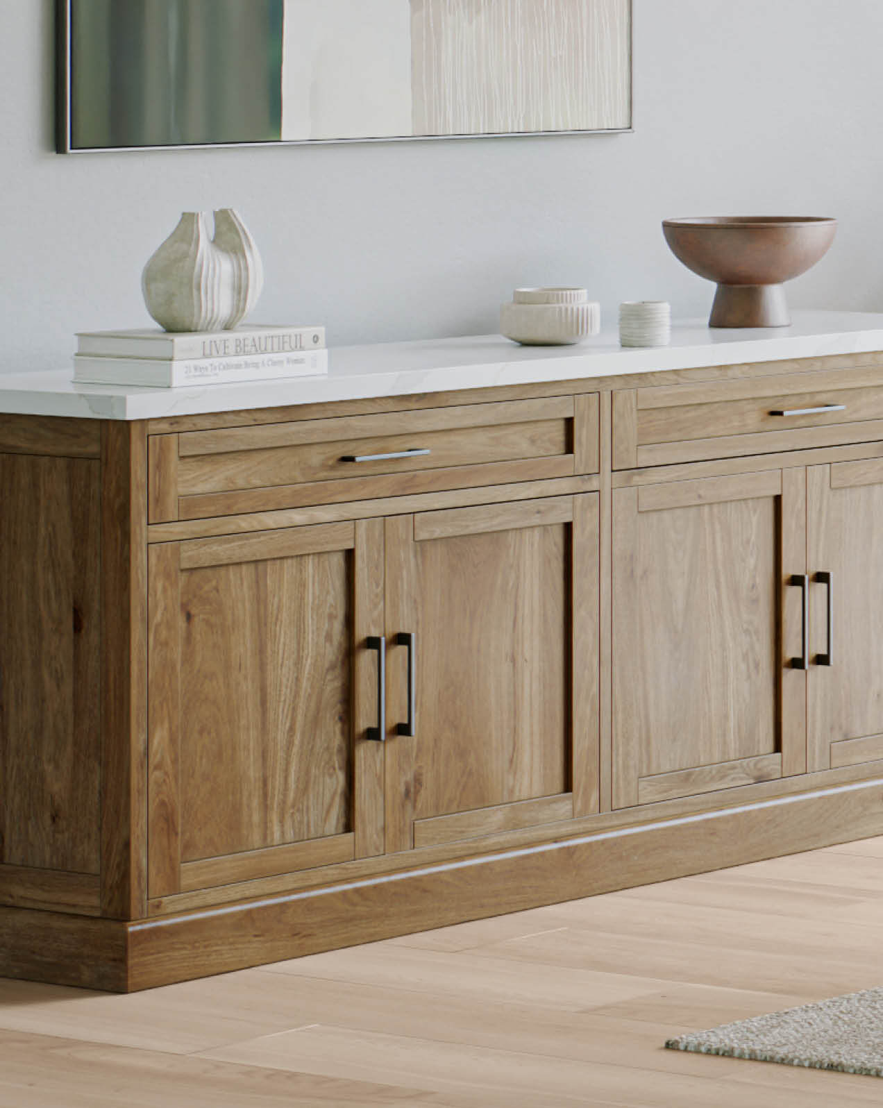 Matteo buffet cabinet in natural timber finish with clean lines, styled with modern decorative accents.