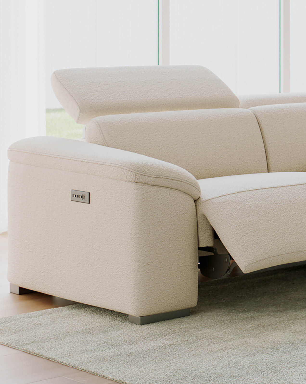 Close-up of the Fiorella beige recliner sofa showing extended footrest and side control buttons